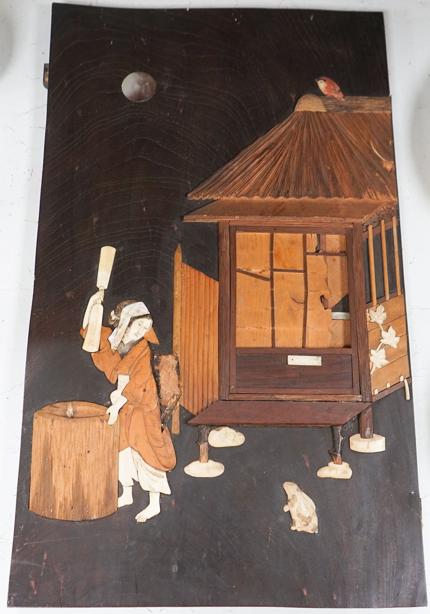 A Japanese Meiji period bone, ivory and mother of pearl overlaid hardwood panel, 60.5x36cm